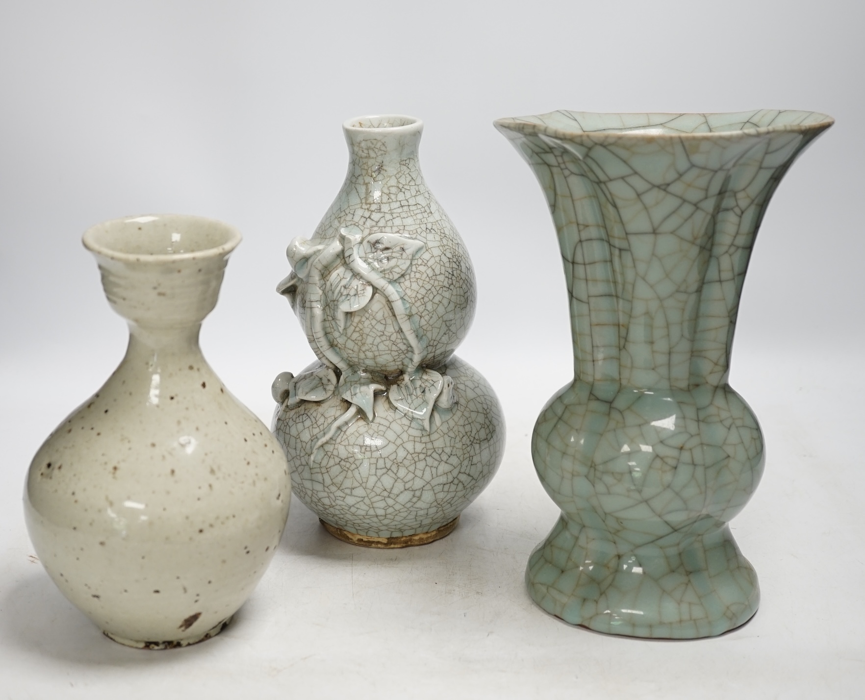 A Chinese underglaze blue and copper red lamp, two crackle glaze vases and a studio pottery bottle, largest 29cm high. Condition - fair